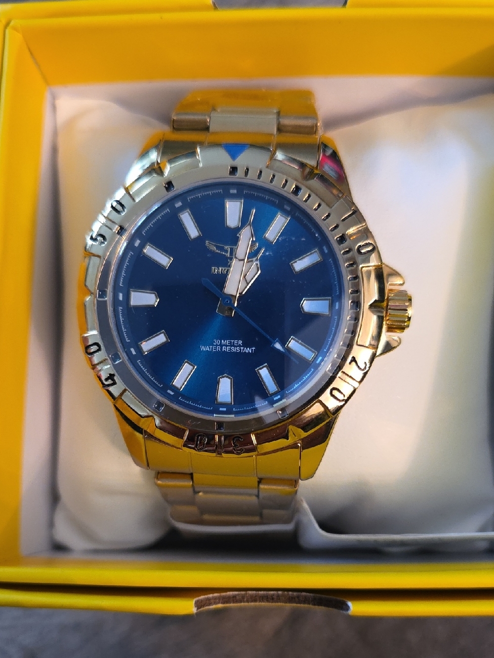 25. Invicta Gold-Tone Metal Watch with Blue Dial